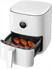 A white Xiaomi Mi Smart Air Fryer with chicken wings inside the basket. Podgląd zdjęcia produktu