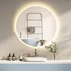 A modern bathroom scene featuring a round LED mirror above a sink and bathtub. Produktbild-Vorschau