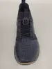 A top-down view of a blue sneaker with text printed on it. Voir les images du produit