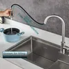 A kitchen sink with a faucet filling a pot with water. Produktbild-Vorschau