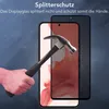 A hand is holding a hammer and is about to strike a smartphone screen protector. The smartphone screen is visible underneath the protector, and the protector shows a spiderweb-like crack pattern where the hammer has made contact. Produktbild-Vorschau