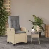 A beige rattan armchair with a gray cushion sits on a tiled patio next to a small glass-topped table with a plant and lantern. Podgląd zdjęcia produktu