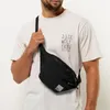 A man wearing a white t-shirt and a black hip bag. Anteprima dell’immagine prodotto