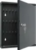A gray metal key cabinet with its door open, revealing numbered hooks for keys. A key is in the lock. Produktbild-Vorschau