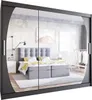 A bedroom scene reflected in a mirrored wardrobe. Produktbild-Vorschau