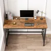 A top-down view of a rustic industrial-style computer desk with a monitor, keyboard, mouse, lamp, and books. Podgląd zdjęcia produktu