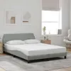 A bedroom scene with a bed, two pillows, and a nightstand. Produktbild-Vorschau