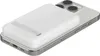 A white Belkin BoostCharge Pro magnetic power bank is attached to the back of a silver iPhone. Voir les images du produit