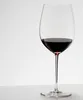 A glass of red wine on a white surface against a white background. Produktbild-Vorschau