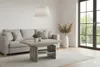A living room scene with a couch and coffee table. Produktbild-Vorschau