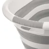 A close-up shot of the handle and upper rim of a collapsible laundry basket. Anteprima dell’immagine prodotto