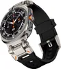 A close-up, angled studio shot of a smartwatch with a black silicone strap and a silver-toned metal casing. Náhled obrázku produktu