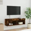 A wall-mounted TV cabinet with a TV above it, in a room setting with a plant and basket. Produktbild-Vorschau