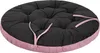 A round, tufted cushion with a dark gray top and a pink border. Produktbild-Vorschau