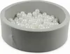 A ball pit filled with white balls. Voir les images du produit