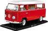 A red and white Volkswagen Transporter T2A camper van model on a black display stand. Náhled obrázku produktu