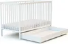 A white crib with a pull-out drawer underneath, shown against a white background. Voir les images du produit