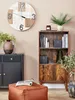 A living room scene with a pouf, bookshelf, and clock. Náhled obrázku produktu