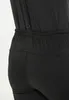 A close-up view of the waist and upper leg area of black softshell pants. Produktbild-Vorschau