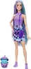 A Barbie doll with long purple and teal hair, wearing a purple top and a purple and blue polka dot skirt, stands next to a small blue cat-like figure in a purple cup. Voir les images du produit