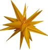 A yellow star-shaped decoration, likely for Christmas or other festive occasions, is shown against a white background. Produktbild-Vorschau