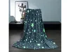 A gray blanket with glow-in-the-dark stars draped over a chair in a room. Anteprima dell’immagine prodotto