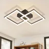 A modern black LED ceiling light with geometric square shapes, mounted on a white ceiling. Produktbild-Vorschau
