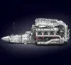 A detailed model of a V8 Biturbo engine, likely made from building blocks, is displayed against a dark background. Produktbild-Vorschau