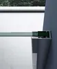A close-up view of a shower enclosure's corner, showing the glass panel and its metallic frame. Produktbild-Vorschau