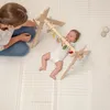 A mother is playing with her baby on a playmat. Náhľad obrázku produktu