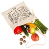 A canvas tote bag filled with fresh produce, including asparagus, zucchini, bell pepper, apples, and strawberries, is shown against a white background. Náhled obrázku produktu