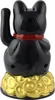 A black lucky cat figurine with a red collar sits on a base of gold coins. Produktbild-Vorschau