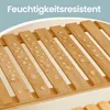 Close-up of a slatted bamboo shelf with water droplets on it, with text overlay. Produktbild-Vorschau