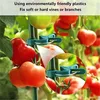 Close-up of tomato plants with clips attached to the stems. Produktbild-Vorschau
