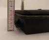 A close-up side view of a black cast iron chimney flap with a ruler next to it for scale. Anteprima dell’immagine prodotto