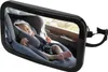 A baby sleeping in a car seat, viewed through a car mirror. Podgląd zdjęcia produktu