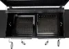 An overhead view of the inside of a black charcoal grill, showing two metal charcoal trays with perforated bottoms. Produktbild-Vorschau