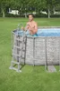 A man is climbing out of an above-ground swimming pool using a ladder. Produktbild-Vorschau