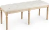 A tufted upholstered bench with wooden legs, shown from a 3/4 angle on a white background. Podgląd zdjęcia produktu