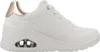 A white sneaker with rose gold accents and a visible air cushion in the sole. Voir les images du produit