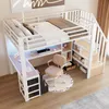 A loft bed with a desk and storage stairs. Voir les images du produit
