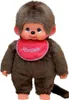 A Monchhichi doll wearing a red bib. Produktbild-Vorschau