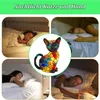 A collage of images showing people sleeping in beds, with a stained-glass cat lamp in the center. Produktbild-Vorschau