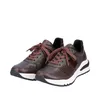A pair of brown leather sneakers with white soles and laces, shown against a white background. Produktbild-Vorschau