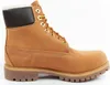 A side view of a single brown Timberland boot against a white background. Produktbild-Vorschau