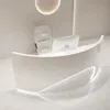 A modern reception desk with a computer and chair in a minimalist setting. Produktbild-Vorschau