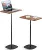 Two adjustable height side tables with wooden tops and black metal stands, one holding a laptop and the other a book and coffee cup. Produktbild-Vorschau
