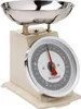 A close-up studio shot of a cream-colored kitchen scale with a silver bowl. Náhled obrázku produktu