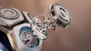 A close-up, exploded view of the internal components of an electric shaver. Anteprima dell’immagine prodotto