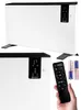 A collage of a white electric heater with a black top, a remote control, and two batteries. Voir les images du produit